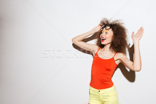 Unusual model waving to the side Stock photo © deandrobot