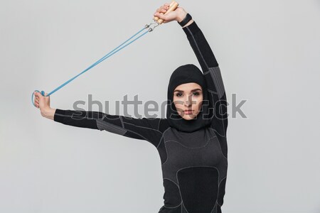 Pretty lady wearing virtual reality device and pointing Stock photo © deandrobot