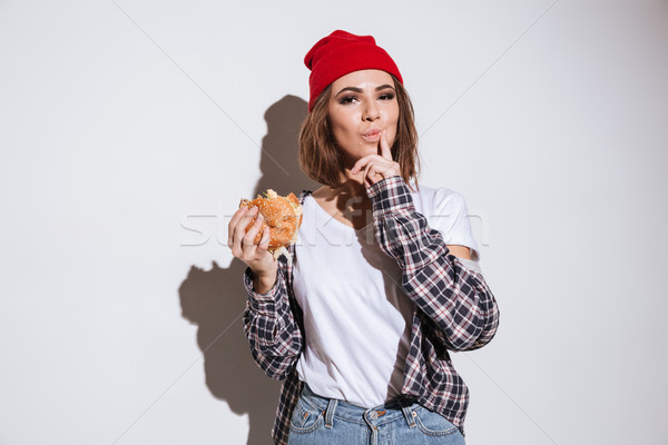 ストックフォト: 小さな · 飢えた · 女性 · 食べ · ハンバーガー · 写真