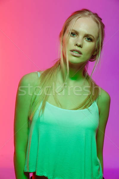Szokatlan portré fiatal nő néz kamera függőleges Stock fotó © deandrobot