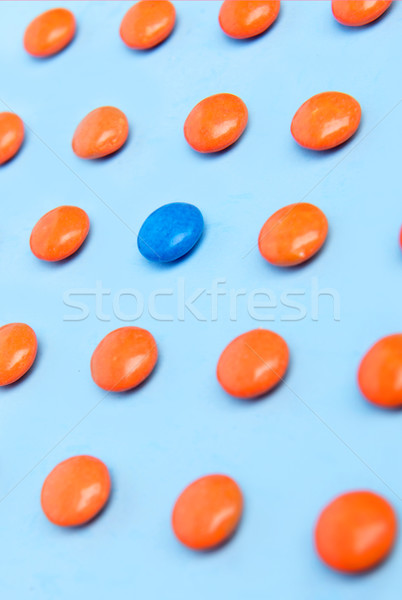 Colorful sweeties candy over blue table background. Stock photo © deandrobot