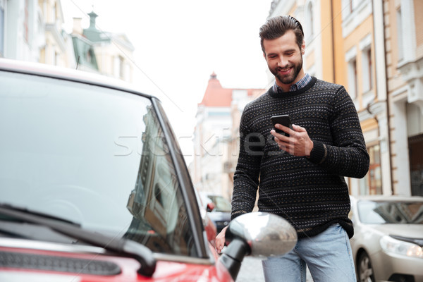 Portrait of a satisfied young man Stock photo © deandrobot