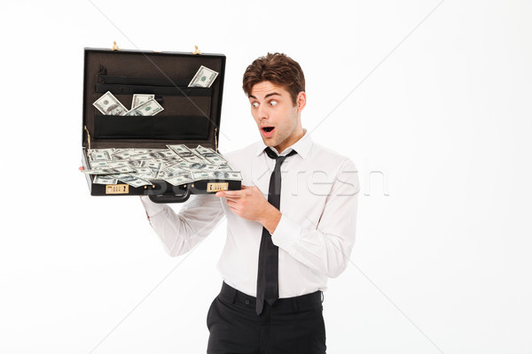 Portrait of a shocked young businessman Stock photo © deandrobot