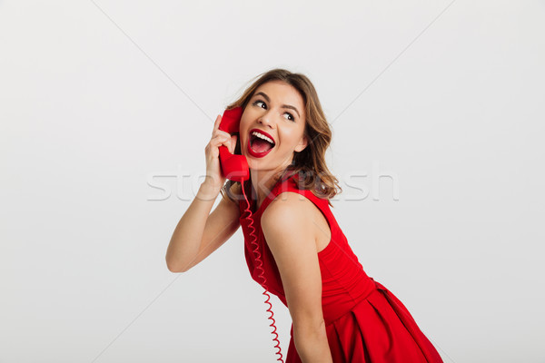 ストックフォト: 肖像 · かなり · 若い女性 · 赤いドレス · 話し · 電話