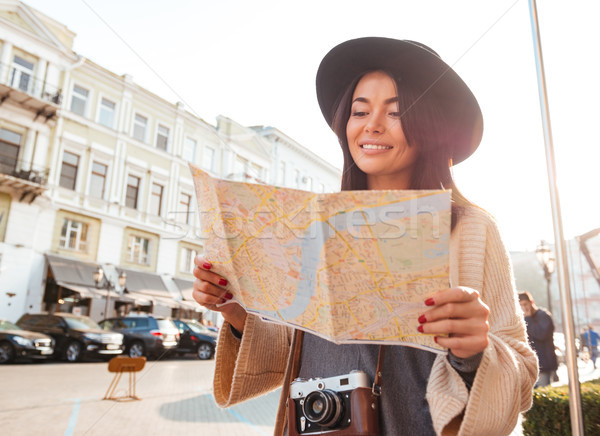 Portrait of a happy pretty woman tourist Stock photo © deandrobot