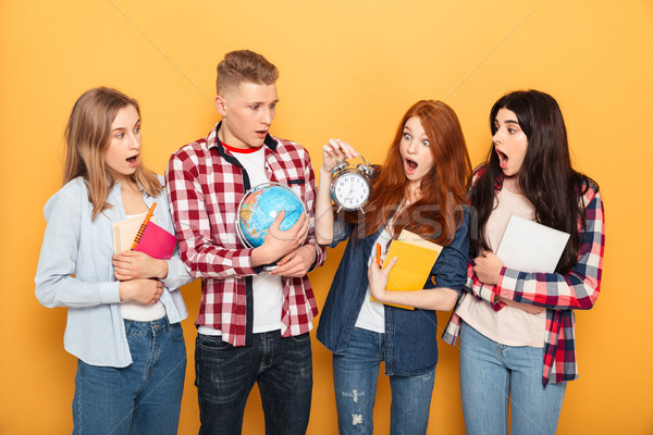 Group of shocked school friends Stock photo © deandrobot