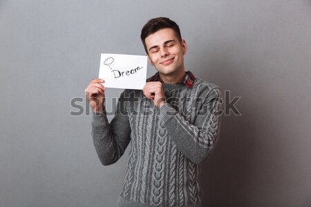 Happy casual man using laptop  Stock photo © deandrobot
