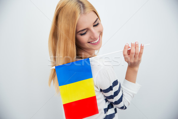 Woman holding Romanian fla Stock photo © deandrobot