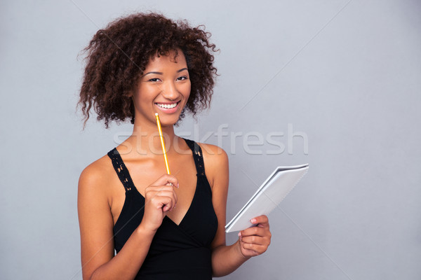 Afro amerikan kadın defter kalem Stok fotoğraf © deandrobot