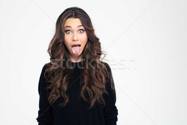 Portret mooi meisje tonen tong jonge geïsoleerd Stockfoto © deandrobot