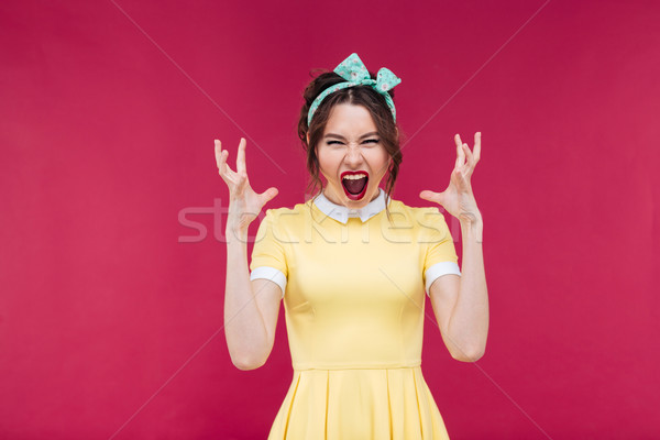 Stock photo: Crazy furious young woman standing and shouting