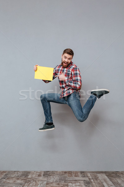 привлекательный бородатый человека копия пространства прыжки Сток-фото © deandrobot