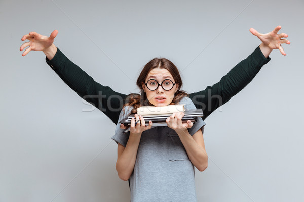 Wronged Female nerd with man behind her Stock photo © deandrobot