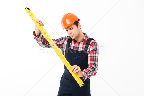 Portret geconcentreerde jonge mannelijke bouwer Stockfoto © deandrobot