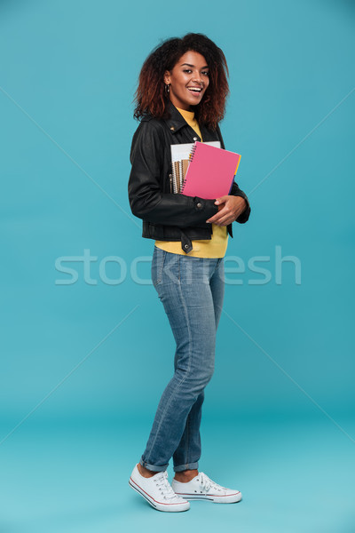 Imagen sonriendo África mujer chaqueta de cuero Foto stock © deandrobot