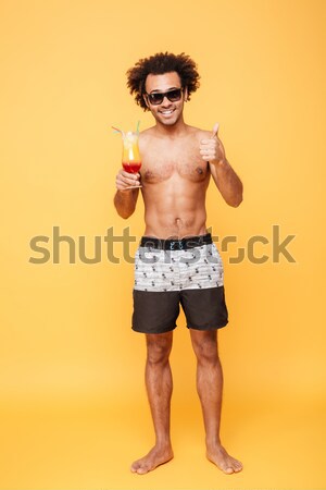 Immagine sorridere nudo uomo pantaloncini Foto d'archivio © deandrobot