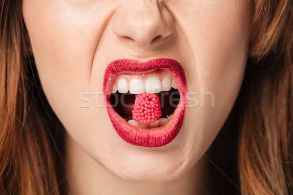 Close up portrait of a hungry brown haired woman Stock photo © deandrobot