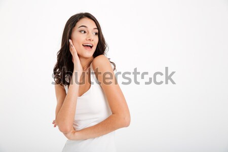 Portrait of a pretty girl dressed in tank-top looking away Stock photo © deandrobot