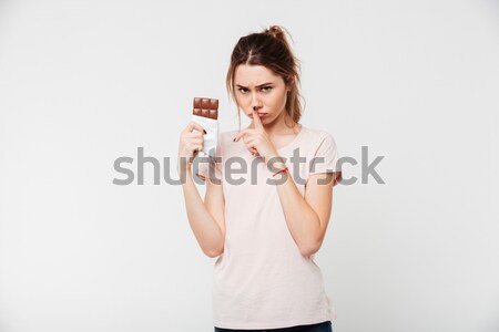 Portré aranyos csinos lány tart csokoládé szelet Stock fotó © deandrobot