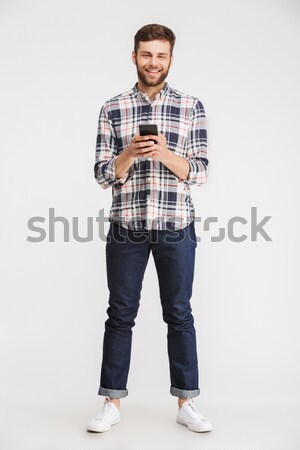 Boldog férfi áll táblagép teljes alakos portré Stock fotó © deandrobot
