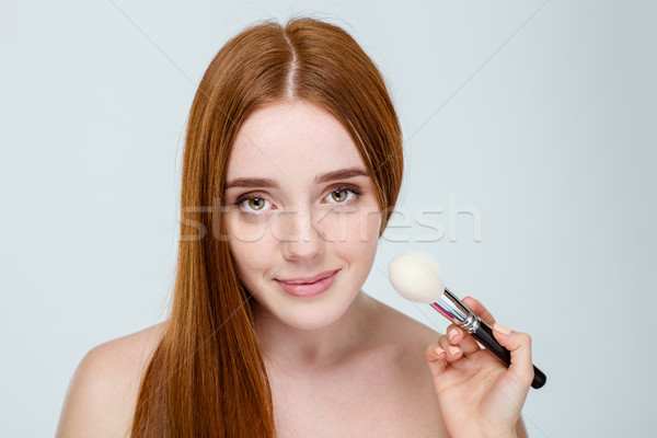 Beautiful young redhead woman with freckles portrait isolated on white Stock photo © deandrobot