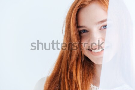 Smiling woman looking at camera Stock photo © deandrobot