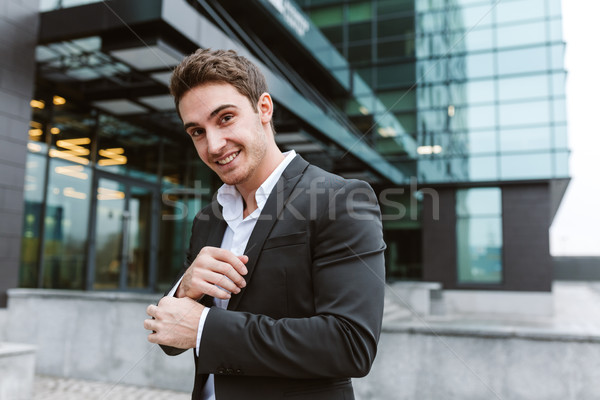 Handsome business man near the office Stock photo © deandrobot