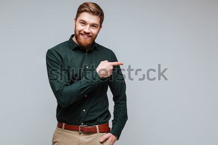 微笑 大鬍子 男子 綠色 襯衫 武器 商業照片 © deandrobot
