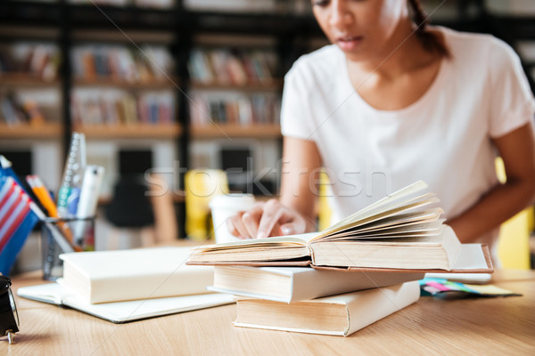 Cropped image of African woman in library Stock photo © deandrobot
