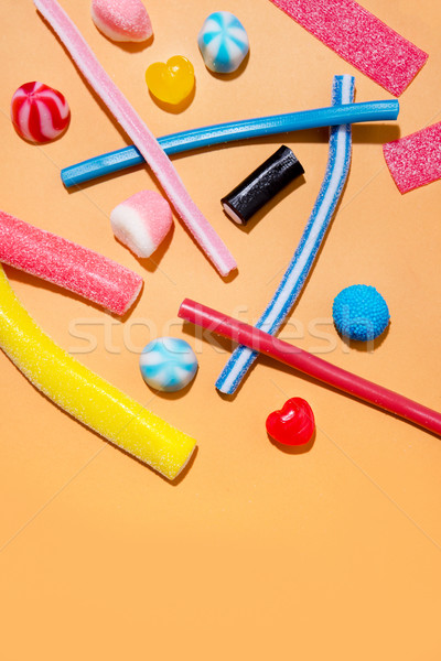 Mixed colorful candies jellies on the pink background Stock photo © deandrobot