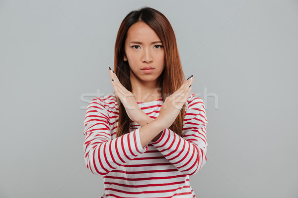 Portré ázsiai nő mutat kézmozdulat kezek Stock fotó © deandrobot