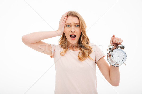 çığlık atan genç kadın çalar saat fotoğraf ayakta Stok fotoğraf © deandrobot