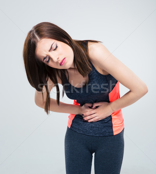 Femeie durere stomac gri fată Imagine de stoc © deandrobot
