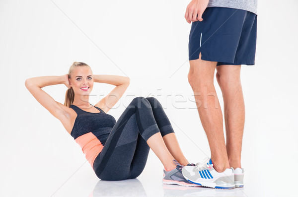 Woman doing abs exercises Stock photo © deandrobot