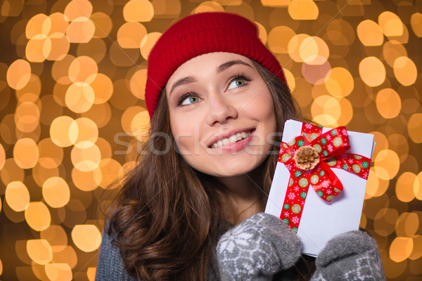 Inspired lovely girl holding blank cards with red ribbon  Stock photo © deandrobot