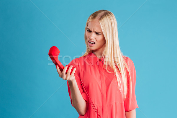 Supărat suparat femeie tipa telefon tub Imagine de stoc © deandrobot