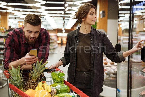 Fiatal derűs szerető pár áruház kép Stock fotó © deandrobot