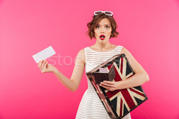 Full length portrait of a surprised girl dressed in dress Stock photo © deandrobot