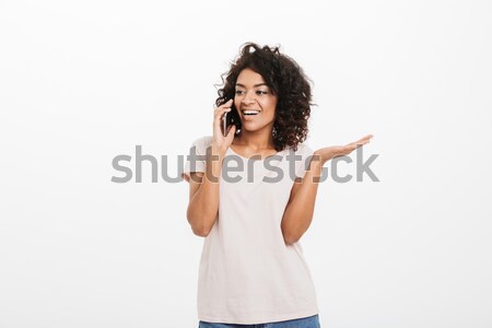 Portrait of adorable smiling woman with trendy hairstyle wearing Stock photo © deandrobot