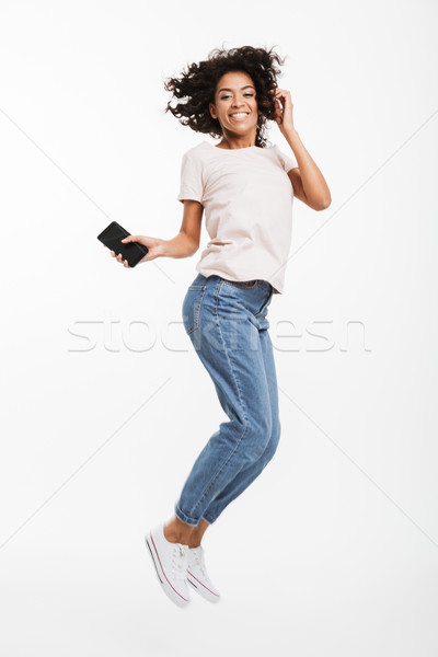 Full length image of happy african american woman with brown cur Stock photo © deandrobot