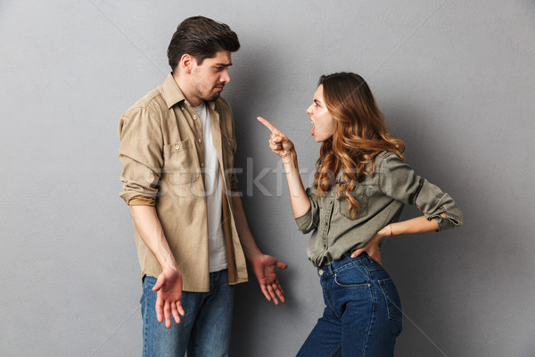 Portrait of an angry young couple having an argument Stock photo © deandrobot