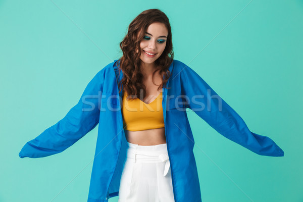 Portret młodych atrakcyjna kobieta 20s płaszcz przeciwdeszczowy Zdjęcia stock © deandrobot
