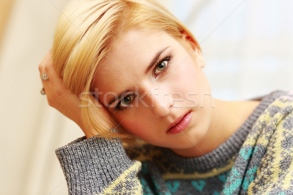 Closeup portrait of young worried woman at home Stock photo © deandrobot