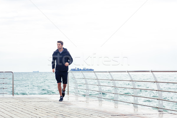 Man running near sea outdoors Stock photo © deandrobot