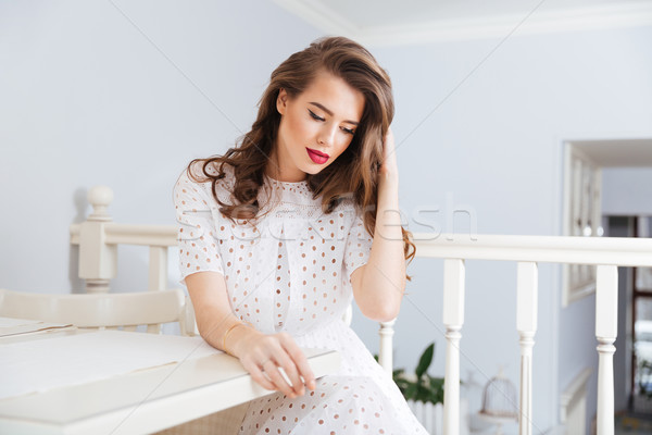 Dalgın şehvetli genç kadın oturma kafe tablo Stok fotoğraf © deandrobot