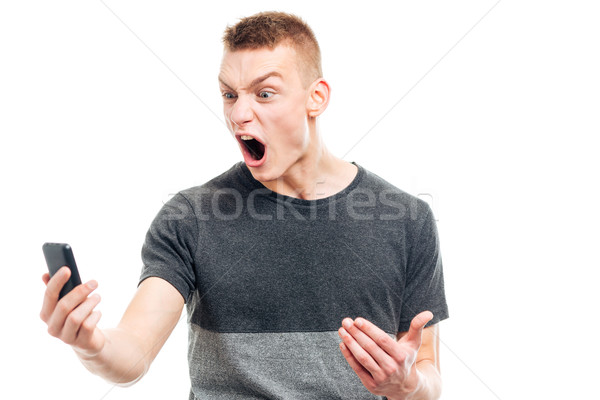 Stock photo: Angry man screaming on the phone