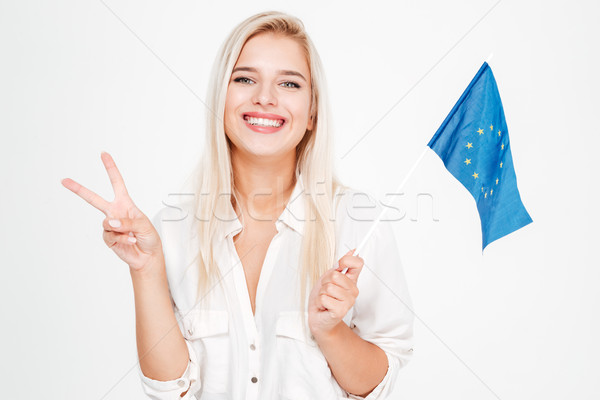 Stock photo: Businesswoman holding flag of European union and showing victory sign