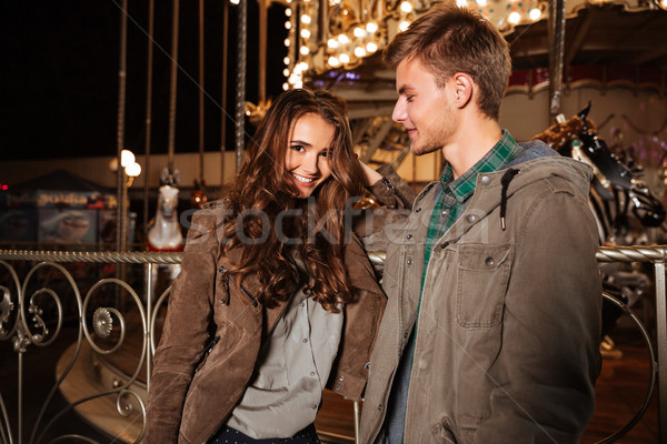 Fashion couple in amusement park Stock photo © deandrobot