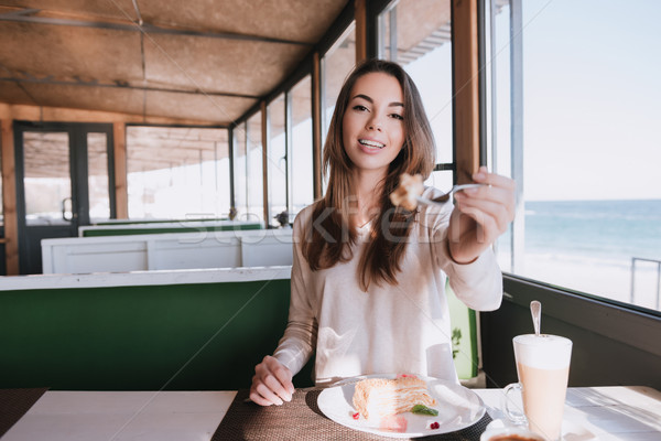 Woman on date with coffee and cake in cafe Stock photo © deandrobot