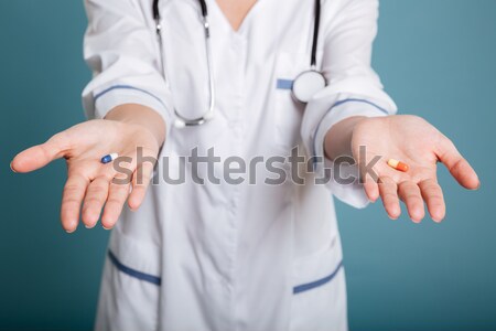 Shot of showing pills in hand of nurse and thumb up Stock photo © deandrobot
